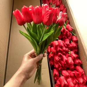Red artificial PU tulips bouquet detail shot, realistic floral decor for home and weddings.