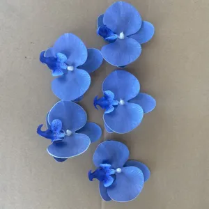 Close-up detail of artificial blue phalaenopsis orchid flower heads for wedding DIY decor