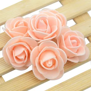 Detailed view of artificial peach foam rose flower heads, perfect for DIY crafts and decor.