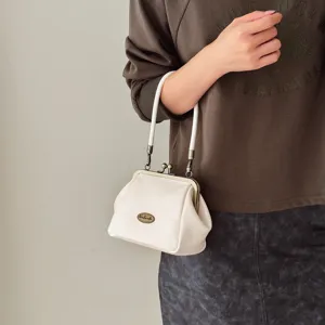 Retro white kiss-lock handbag for women, mini solid color shoulder bag stylish daily.