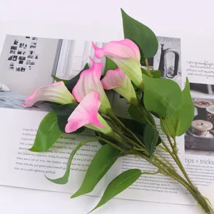 Detail view of 5-head artificial calla lily flower bouquet with pink gradient petals and leaves.