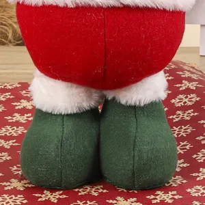Christmas plush doll lower body display with green shoes and red pants festive holiday decor