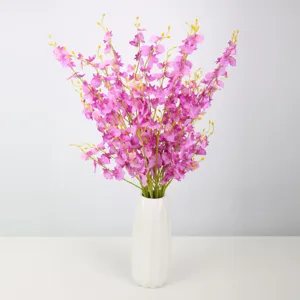 Artificial dancing orchid flowers bouquet in white ceramic vase for home decoration