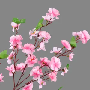 Artificial peach blossom branch detail, pink silk flower petals with brown stem for home decor.