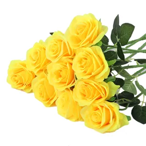 Detailed view of vibrant yellow artificial silk roses bouquet for home decor and wedding.