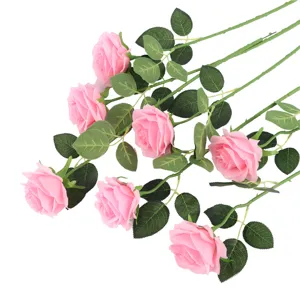 Detail view of artificial pink rose single branch silk flower for home wedding party decoration.