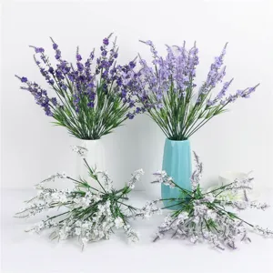 Artificial lavender bouquet detail, purple and white floral arrangement in vases for decor.