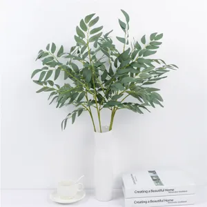 Artificial green plant willow leaf bundle detail shot, fresh forest style floral decor.