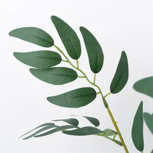 Artificial willow leaf branch detail shot, realistic greenery for floral arrangements and plant walls.