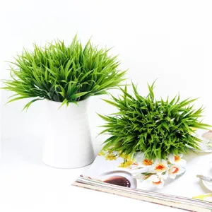 Artificial spring grass potted plant in white vase and bundle for indoor home decor display.