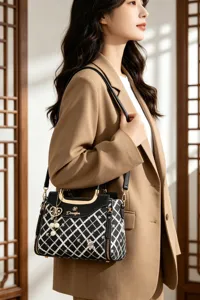 Elegant black and white plaid shoulder bag for women, stylish crossbody handbag with chain.