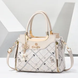 Chic women PU leather shoulder bag with plaid pattern, bear print and pearl pendant for daily use.