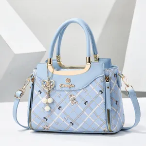 Light blue plaid shoulder bag with metal handle, cute bear print and crossbody strap.