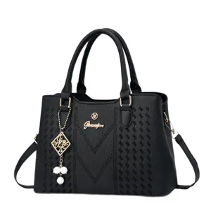 Elegant black top-handle handbag, versatile casual daily commuter crossbody bag with charm.