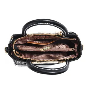 Detail view of the stylish commuter women's handbag interior, featuring multi-compartment zip design.