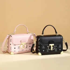 Chic PU leather top handle square bag with monogram print, metal lock, and shoulder strap.