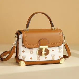 Stylish women's colorblock top handle shoulder bag with retro lock and chic design.