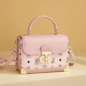 Chic pink print box handbag with top handle and crossbody strap, stylish daily shoulder bag.