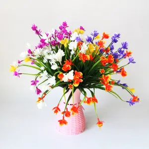 Artificial Phalaenopsis flower potted plant detail view, vibrant plastic floral decoration for home.