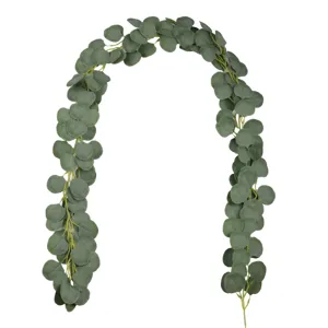 Detailed view of artificial eucalyptus leaf garland, flexible vine for home decor.