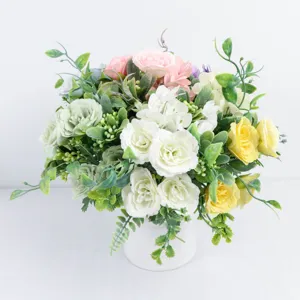 Detailed closeup of artificial rose and hydrangea floral arrangement in white vase for decor.