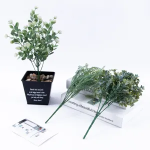 Artificial eucalyptus potted plant with green leaf stems for home wedding decor detail.