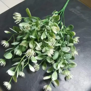 Artificial eucalyptus leaf bouquet detail shot, fake green plant for wedding decor.