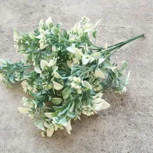 Close-up detail shot of artificial eucalyptus leaves for home decor floral design.