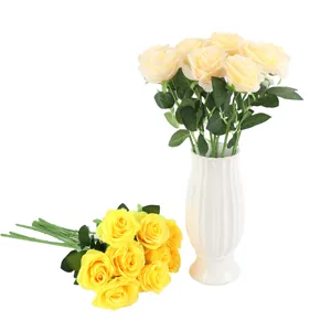 Detailed close-up of artificial rose flowers, showing realistic petals and green leaf texture.