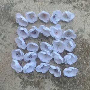 Artificial plum blossom flower heads for DIY crafts, wreaths, and garment decoration.