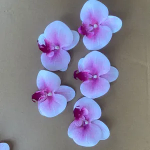 Artificial phalaenopsis flower heads for wedding DIY decor craft display detail view.