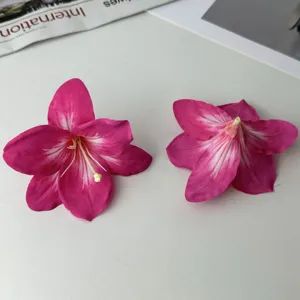 Detailed closeup of artificial fuchsia lily flower heads for DIY hair clips crafts decoration.