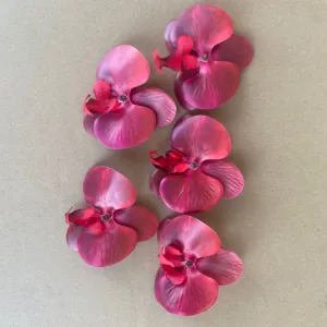 Artificial phalaenopsis orchid flower heads, detail view for DIY crafts and wedding decor.