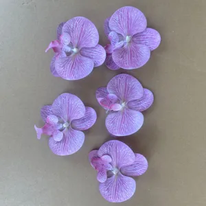 Artificial phalaenopsis orchid flower heads for DIY crafts and wedding decor details.