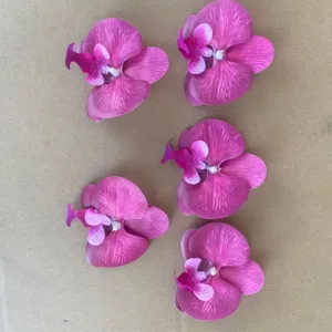 Close-up detail of vibrant artificial phalaenopsis flower heads, perfect for DIY and decor.