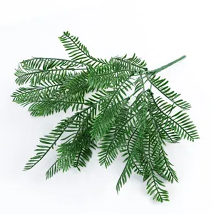 Branche de fougère verte artificielle feuillage plastique faux pour décoration murale intérieur.