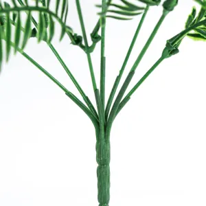 Vue détaillée de la structure de tige verte de fougère artificielle pour décoration paysagère.