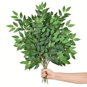 Detailed shot of artificial eucalyptus leaves bunch, perfect for home table decor and styling.