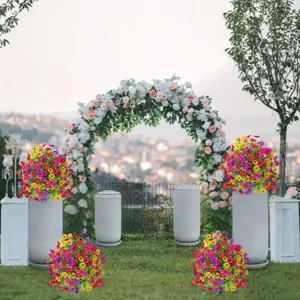 Outdoor garden scene detail of vibrant artificial flower bouquets and potted plants for decoration.