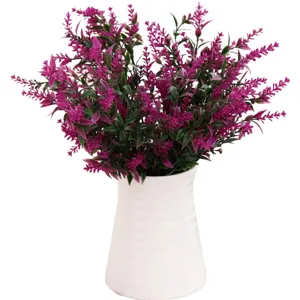 Artificial lavender flowers in white ceramic vase for home living room decor fake plant.