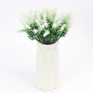 Close up view of the artificial lavender bouquet details, showing fine plastic flowers.