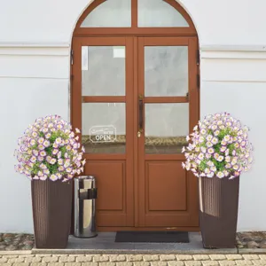 Artificial morning glory flower in tall planter, elegant detail for garden and home decor.