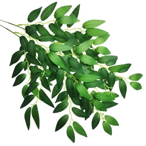 Detailed shot of artificial faux willow leaves greenery branch for home decor styling.