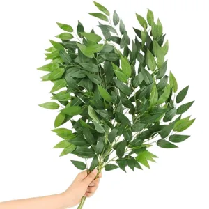 Detailed view of artificial willow leaves branch, realistic green plant bouquet for home decor.