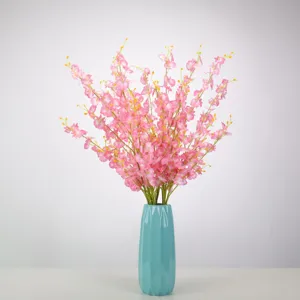 Artificial dancing orchid silk flowers in blue ceramic vase for living room home decor