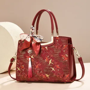 New Chinese embroidered shoulder bag with vintage crane pattern, red leather handle and tassel.