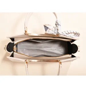 Detailed top-down view of the handbag interior, showing large capacity and golden hardware.