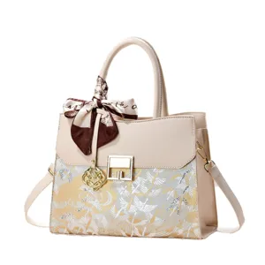 Beige top handle handbag with chic silk scarf and exquisite embroidered crane pattern for women.