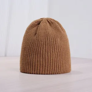 Solid color knitted beanie for winter, warm ribbed winter hat in brown style detail view