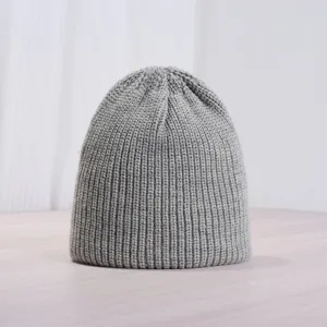 Cozy grey knitted beanie hat for autumn and winter, warm casual solid color retro style.